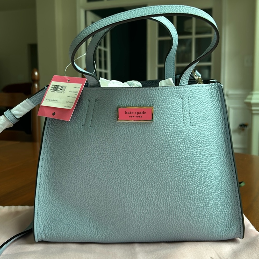 Brand new Kate Spade purse. Retail for $298, selling for $150.